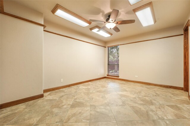 office space featuring ceiling fan and baseboards