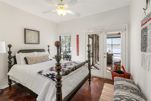 bedroom with concrete floors, french doors, access to exterior, and multiple windows
