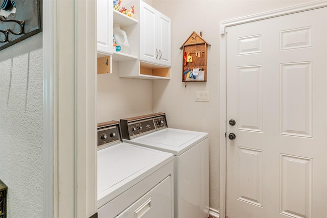 laundry area with cabinet space and washer and dryer