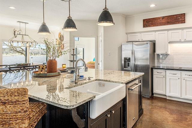 kitchen with crown molding, finished concrete floors, stainless steel refrigerator with ice dispenser, a sink, and decorative backsplash