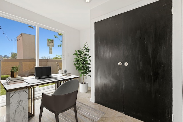 office space featuring light tile patterned floors and a healthy amount of sunlight
