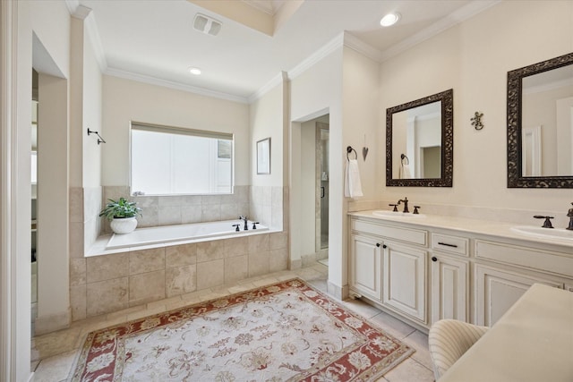 full bath with a sink, visible vents, a bath, and ornamental molding