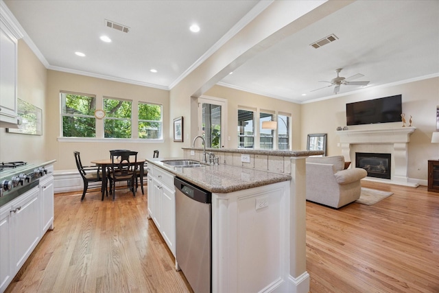 kitchen featuring a sink, visible vents, appliances with stainless steel finishes, and light wood-style floors