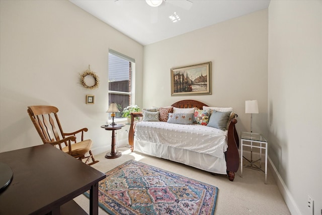 carpeted bedroom with baseboards and a ceiling fan