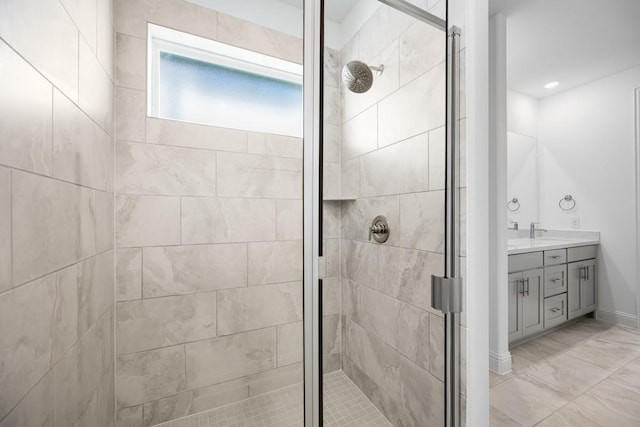 full bathroom with a shower stall and vanity