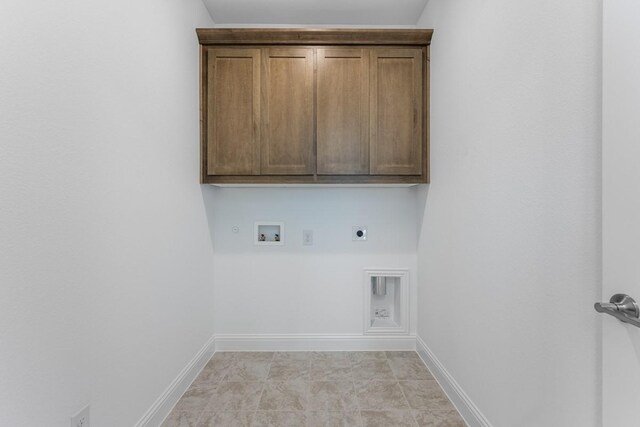 laundry room featuring hookup for an electric dryer, cabinet space, hookup for a washing machine, baseboards, and gas dryer hookup