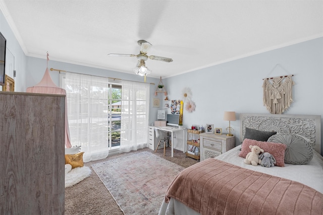 carpeted bedroom with ornamental molding and a ceiling fan