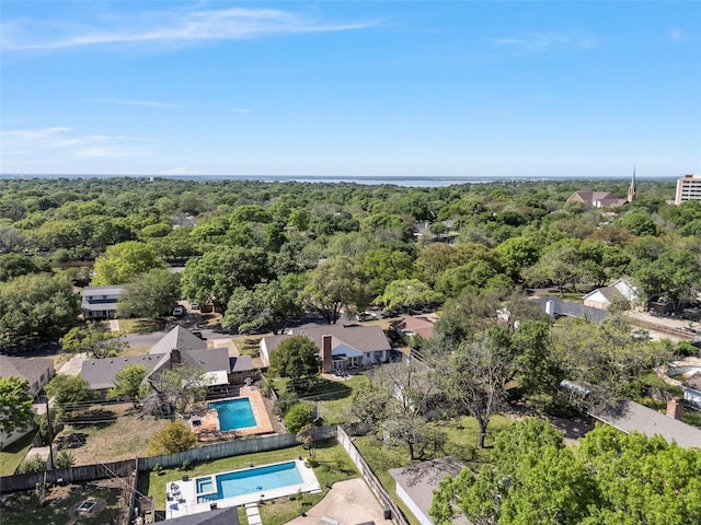 birds eye view of property with a wooded view