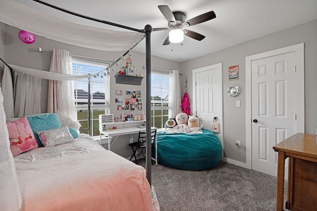 bedroom featuring ceiling fan, carpet, and baseboards
