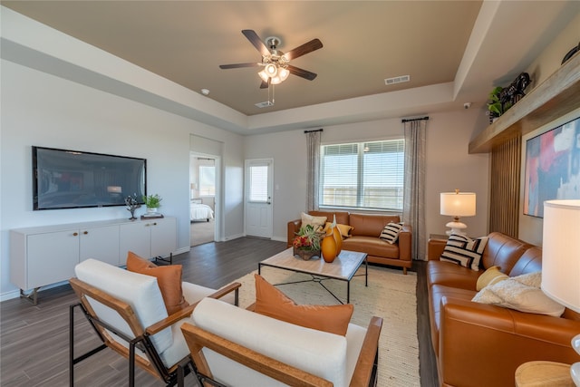 5045 Cervinae Rd, Fort Worth, TX 76036 - living room featuring a tray ceiling, a ceiling fan, wood finished floors, and baseboards