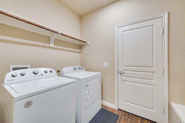 754 Brookline Dr, Lavon, TX 75166 - laundry room featuring washer and clothes dryer, wood finished floors, and baseboards