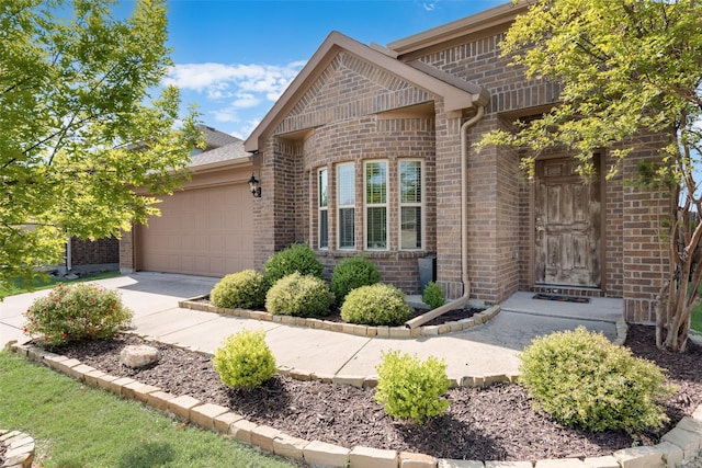 754 Brookline Dr, Lavon, TX 75166 - view of front facade featuring brick siding, an attached garage, and driveway