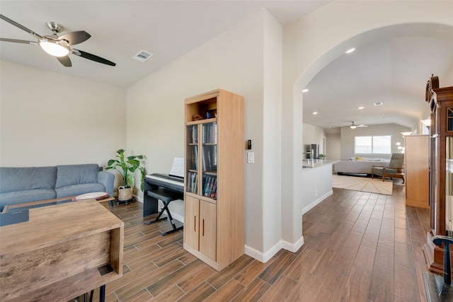 754 Brookline Dr, Lavon, TX 75166 - living area with ceiling fan, arched walkways, wood finished floors, vaulted ceiling, and baseboards