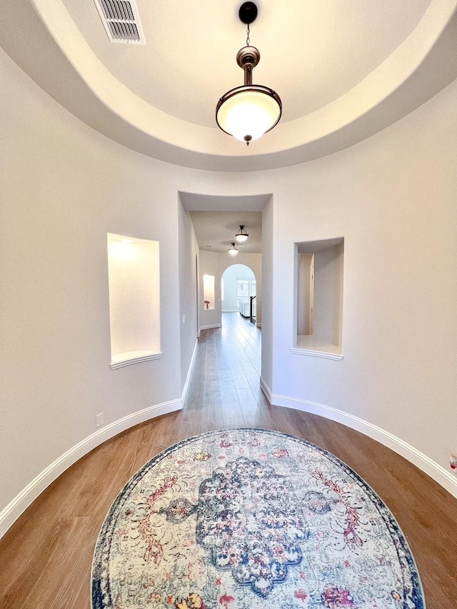 206 Lakewood Ln, Ponder, TX 76259 - hall with arched walkways, wood finished floors, and baseboards