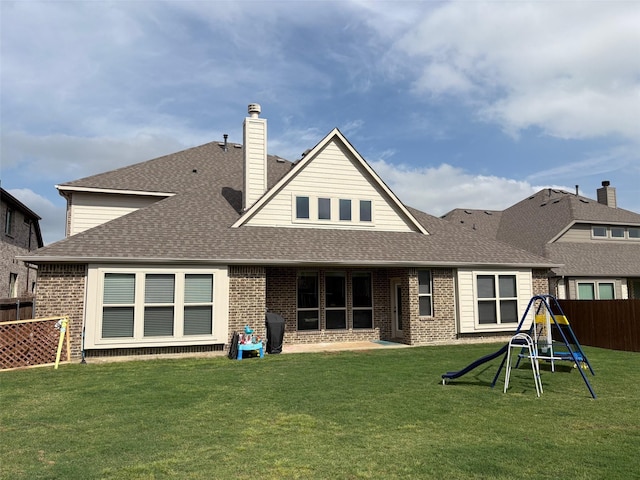 206 Lakewood Ln, Ponder, TX 76259 - back of property with a shingled roof, brick siding, a chimney, and a patio area