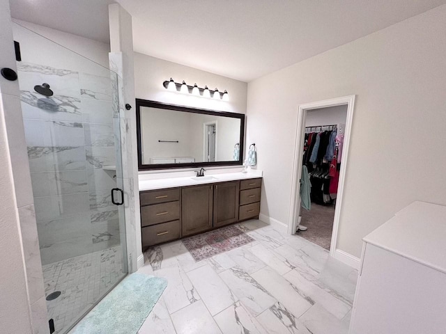 206 Lakewood Ln, Ponder, TX 76259 - bathroom featuring a stall shower, vanity, marble look tile flooring, and baseboards