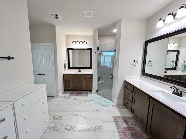 206 Lakewood Ln, Ponder, TX 76259 - full bath with marble finish flooring, a stall shower, baseboards, and two vanities