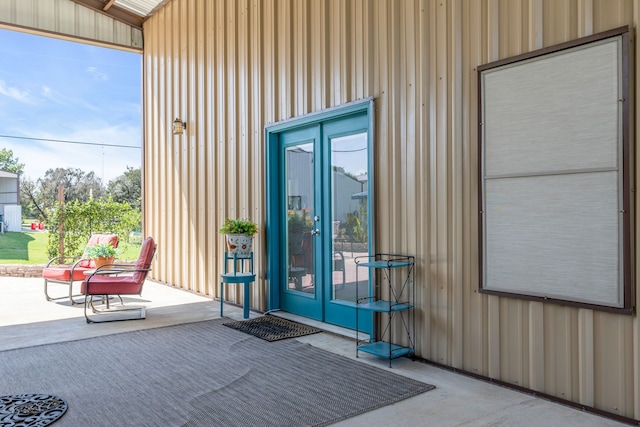 property entrance with french doors and board and batten siding