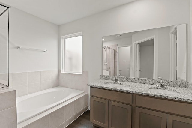 5024 Wellborn Rd, Fort Worth, TX 76036 - full bath with a stall shower, a garden tub, double vanity, and a sink