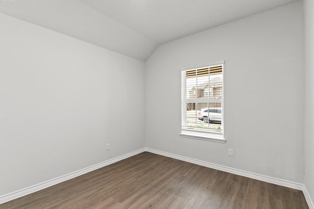 5024 Wellborn Rd, Fort Worth, TX 76036 - unfurnished room with baseboards, vaulted ceiling, and dark wood-type flooring