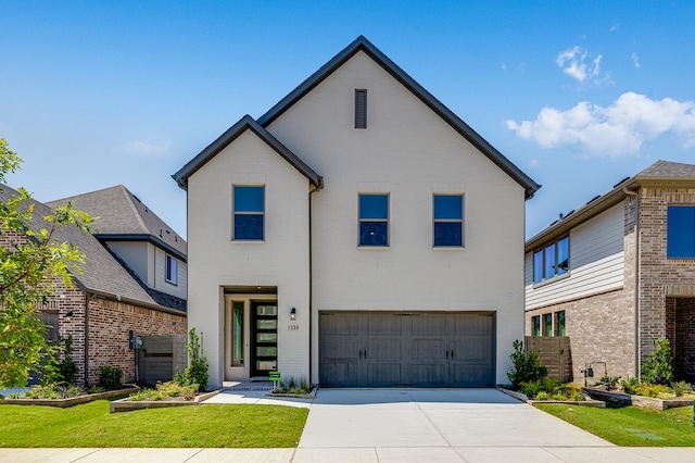 1538 Ginger Ln, Argyle, TX 76226 - view of front of home with concrete driveway, an attached garage, and brick siding