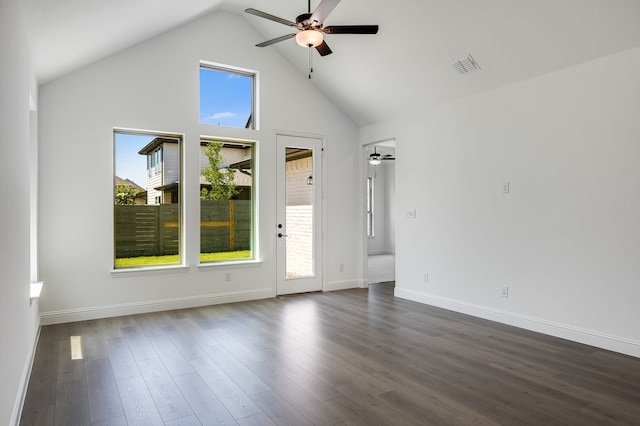 1538 Ginger Ln, Argyle, TX 76226 - empty room with ceiling fan, plenty of natural light, baseboards, dark wood-style floors, and high vaulted ceiling