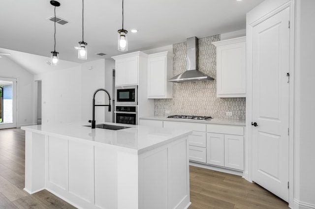 1538 Ginger Ln, Argyle, TX 76226 - kitchen featuring wall chimney range hood, stainless steel oven, a sink, built in microwave, and wood finished floors