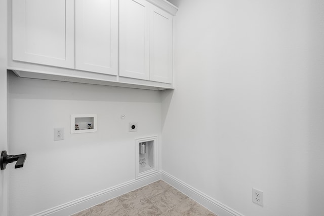 1538 Ginger Ln, Argyle, TX 76226 - laundry room with cabinet space, hookup for an electric dryer, hookup for a washing machine, hookup for a gas dryer, and baseboards