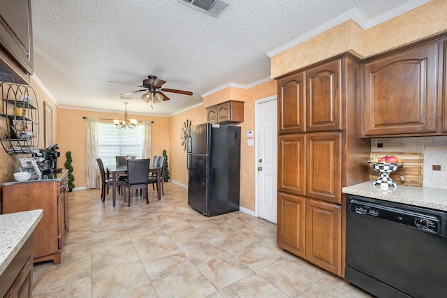 1128 Mason Dr, Hurst, TX 76053 - kitchen featuring visible vents, a textured ceiling, black appliances, ceiling fan with notable chandelier, and light stone counters