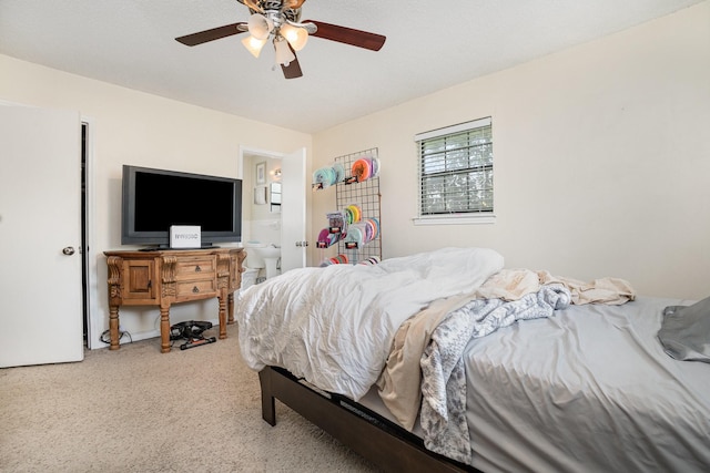 1128 Mason Dr, Hurst, TX 76053 - carpeted bedroom with ensuite bath and a ceiling fan