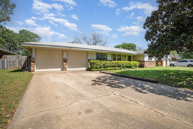 1128 Mason Dr, Hurst, TX 76053 - single story home with fence, a front lawn, brick siding, an attached garage, and driveway
