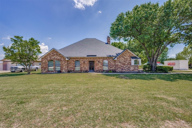 9A Rhea Mills Cir, Prosper, TX 75078 - view of front of house with brick siding, a front lawn, and a chimney