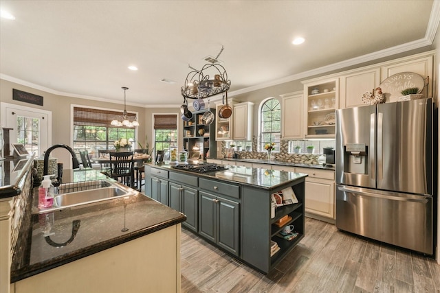 3604 Post Oak Trl, Corinth, TX 76210 - kitchen with appliances with stainless steel finishes, open shelves, a sink, a center island, and ornamental molding