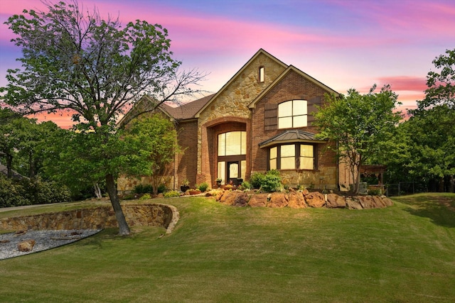 3604 Post Oak Trl, Corinth, TX 76210 - view of front facade with a yard, stone siding, and brick siding