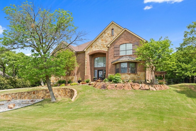 3604 Post Oak Trl, Corinth, TX 76210 - traditional home with brick siding, a front yard, and stone siding