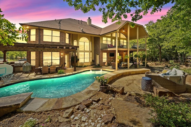 3604 Post Oak Trl, Corinth, TX 76210 - back of house with an outdoor living space, a balcony, area for grilling, brick siding, and a patio area