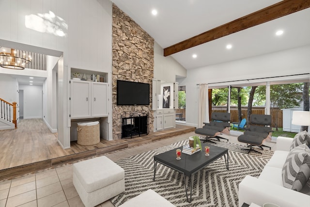 2204 Wood Cliff Ct, Arlington, TX 76012 - living area featuring high vaulted ceiling, a chandelier, light tile patterned floors, a fireplace, and stairway