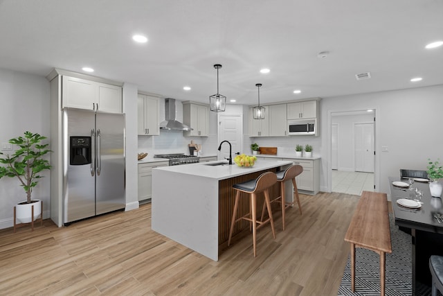 2204 Wood Cliff Ct, Arlington, TX 76012 - kitchen with stainless steel fridge with ice dispenser, white microwave, wall chimney range hood, a sink, and recessed lighting