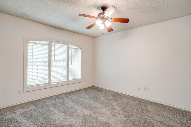 6809 River Bend Rd, Fort Worth, TX 76132 - empty room with carpet floors, baseboards, a ceiling fan, and a textured ceiling