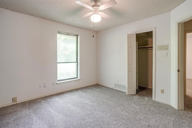 6809 River Bend Rd, Fort Worth, TX 76132 - unfurnished bedroom featuring carpet flooring, a textured ceiling, visible vents, and a closet