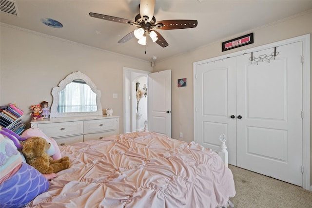 10908 County Road 442, Princeton, TX 75407 - bedroom with a closet, ornamental molding, light carpet, a ceiling fan, and visible vents