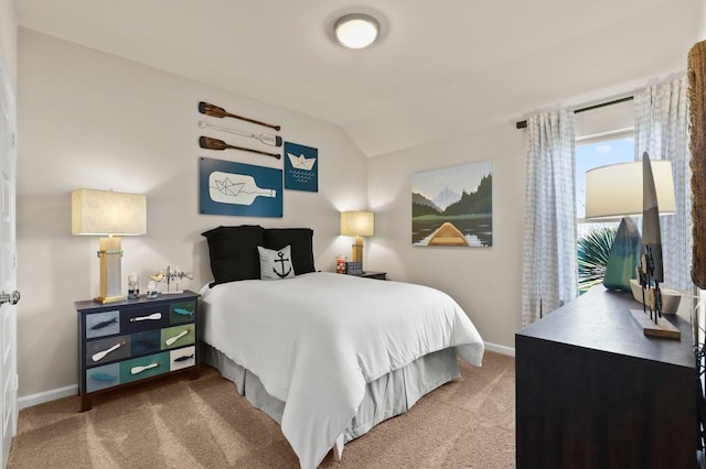 bedroom featuring carpet flooring, baseboards, and lofted ceiling