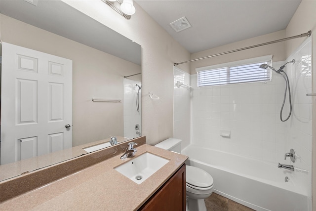 bathroom with toilet, vanity, tub / shower combination, and visible vents