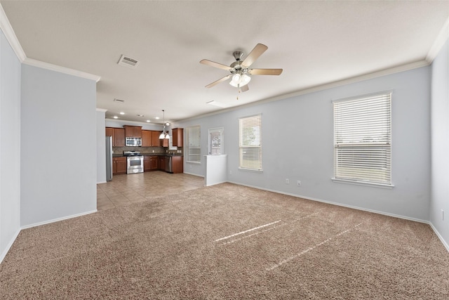 unfurnished living room featuring a ceiling fan, light colored carpet, ornamental molding, and visible vents