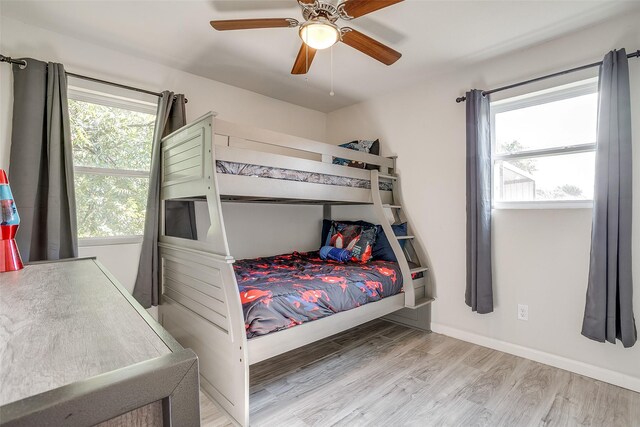 2520 Long Creek Ct, Granbury, TX 76049 - bedroom with ceiling fan, baseboards, and wood finished floors