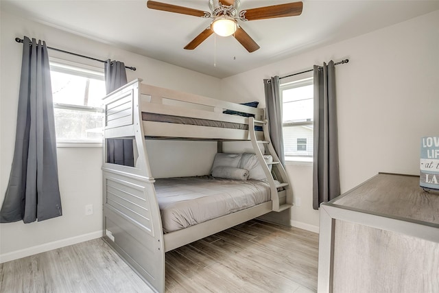 2520 Long Creek Ct, Granbury, TX 76049 - bedroom featuring light wood-type flooring, multiple windows, and baseboards