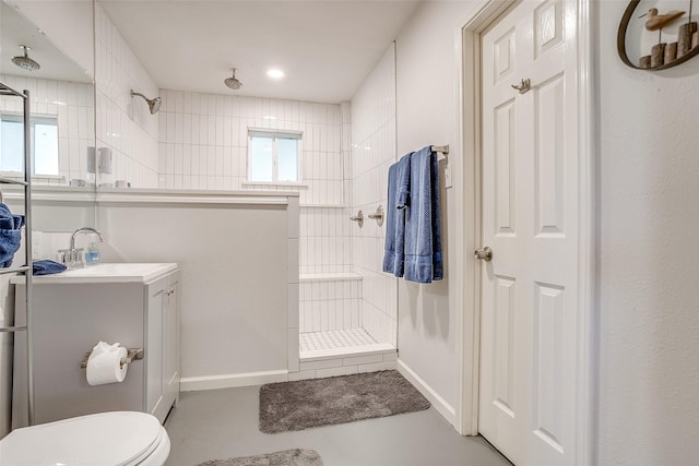 2520 Long Creek Ct, Granbury, TX 76049 - bathroom with a tile shower, concrete floors, vanity, toilet, and baseboards