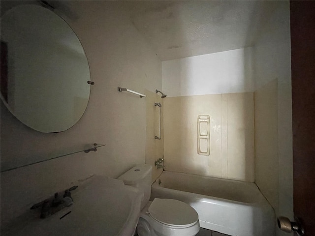 bathroom featuring toilet and bathing tub / shower combination