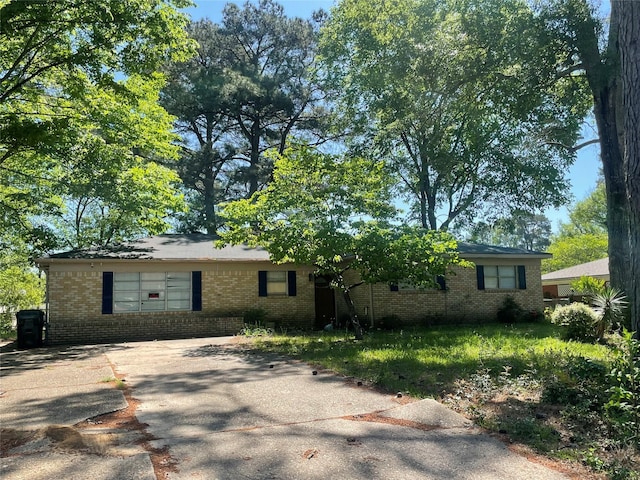 single story home with brick siding