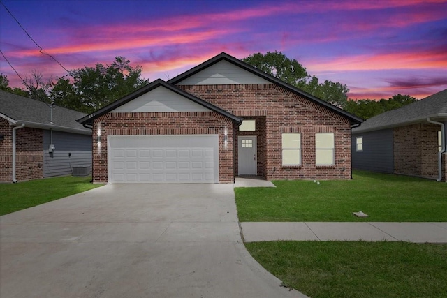 ranch-style house featuring concrete driveway, a garage, a front lawn, and brick siding